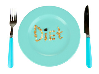 The word Diet laid out on blue bowl of muesli isolated on white