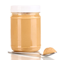 Delicious peanut butter in jar isolated on white