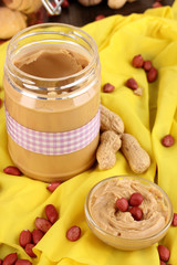 Delicious peanut butter in jar with baking
