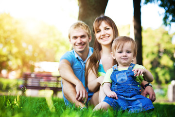 happy family resting in the summer park. picnic