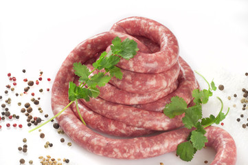 a natural raw sausage on white