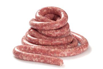 a natural raw sausage on white