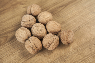 Walnuts on brown wood