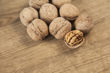 Walnuts on brown wood