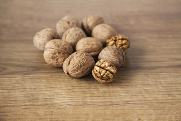 Walnuts on brown wood