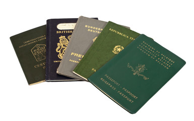 Old international passports isolated on white