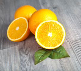 Fresh oranges on wooden table 