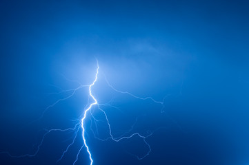 lightning bolt striking the night sky