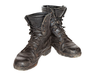 Old black army boots isolated on white