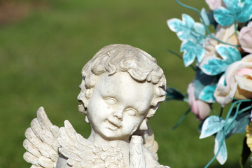 Angel statue and flower bouquet