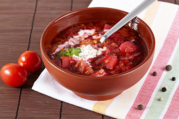 Russian cuisine. Borscht on the served table