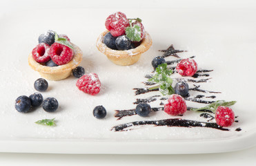 Sweet christmas tree with berries and mint