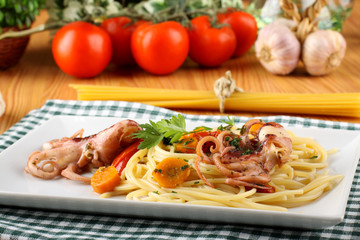 Pasta with octopus, tomatoes and carrots