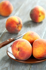 Fototapeta na wymiar Peaches on a wooden table