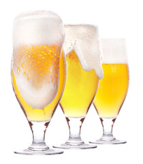 Frosty glass of light beer isolated