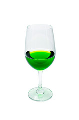 Green juice in a wine glass.