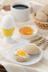 breakfast with muffin, cheese, jam and egg