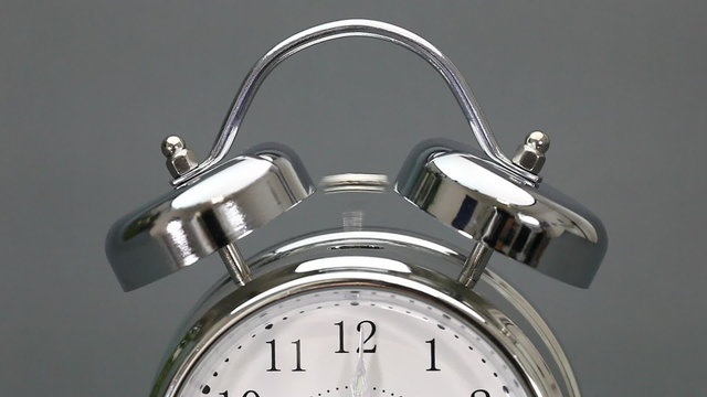 Vintage alarm clock rings seconds past 12 with Sound