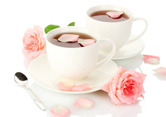 cups of tea with roses isolated on white