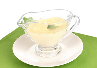 Mayonnaise in bowl on napkin isolated on white