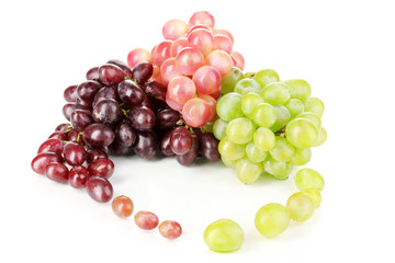 Delicious ripe pink and green grapes isolated on white