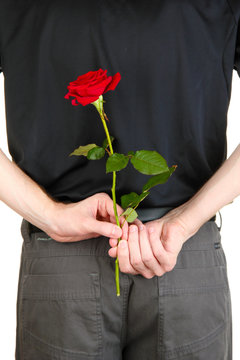 man holding rose close-up