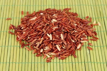 red rice   on bamboo mat