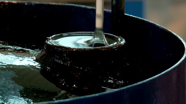 Measuring the density of oil.