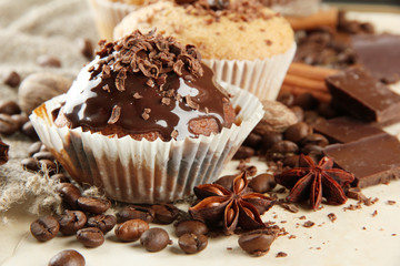 tasty muffin cakes with chocolate, spices and coffee seeds,