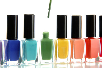 Group of bright nail polishes isolated on white