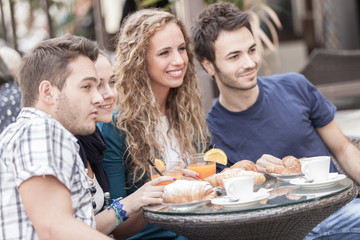 Group of Friends Having a Traditional Italian Breakfast