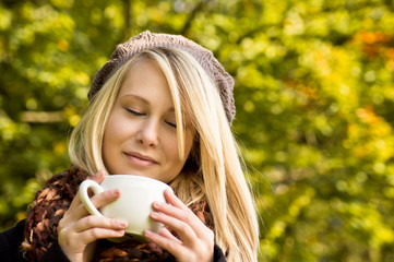 Young Blond Teen Girl with Cup