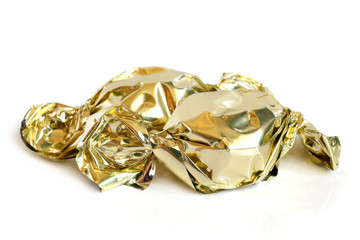 Chocolate sweets in golden foil