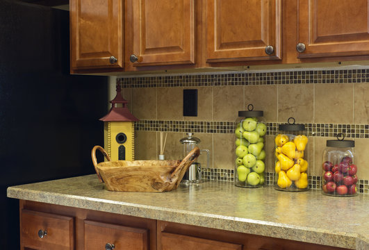 Colorful fruit jar decor on a home kitchen counter