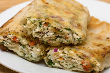Pita bread wrapped with cottage cheese and vegetables