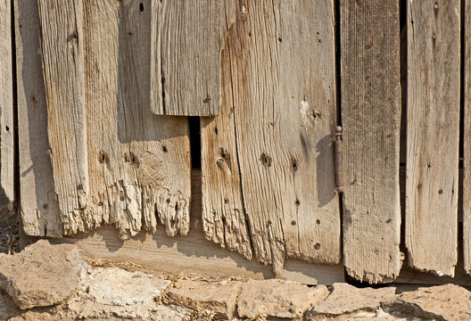 Bottom edges of ragged vintage barn wood boards