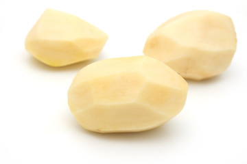 peeled potatoes on a white background