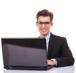 Business man at his desk with a laptop