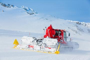 Red machine for skiing slope preparations