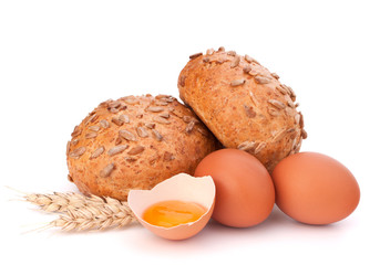 Bun with seeds and broken egg