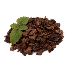 Crushed chocolate shavings pile and mint leaf