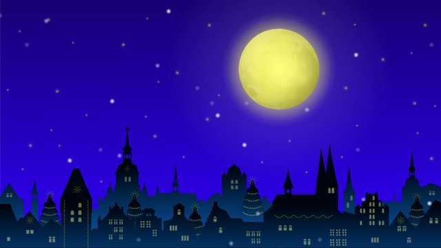 Es schneit vor einer weihnachtlich erleuchteten Stadtkulisse