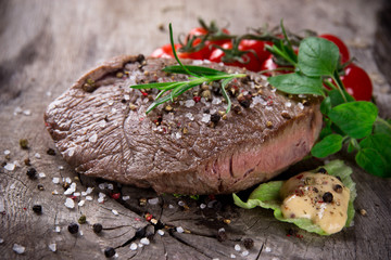 Grilled 500g bbq steak on wooden table