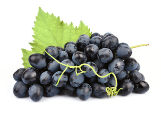 Ripe dark grapes with leaves