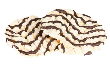 Rice cakes with chocolate over a white background