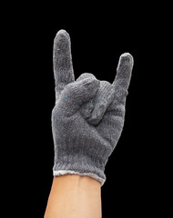 hands knitted gloves on a black background