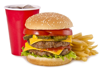 Mouthwatering double cheeseburger with fresh toppings, crispy fries, and a soda cup on a white background. A perfect fast-food meal with melted cheese, juicy beef patties, and flavorful condiments.