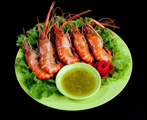 Grilled shrimps seafood display on the dish ready made isolated