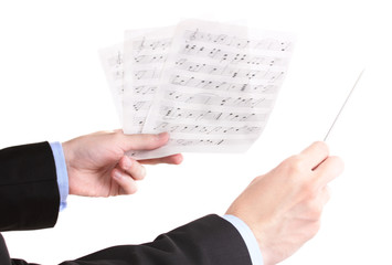 Music conductor hands with baton and notes isolated on white