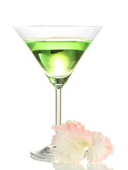 glass with cocktail and gladiolus bud isolated on white